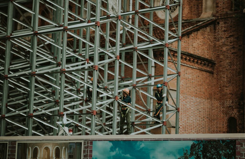 Two Person on Truss Tower